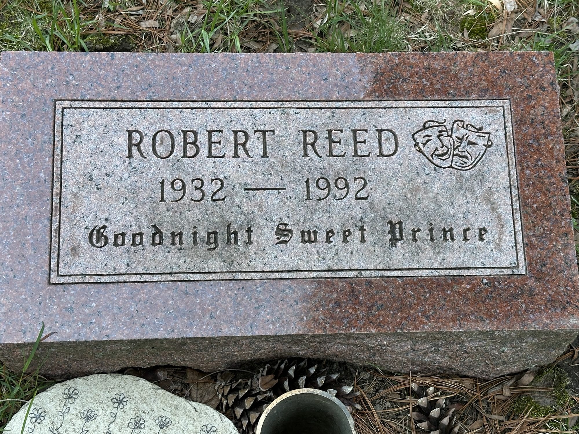 Granite grave marker engraved with the name 'Robert Reed', birth year 1932, death year 1992, and the phrase 'Goodnight Sweet Prince'.