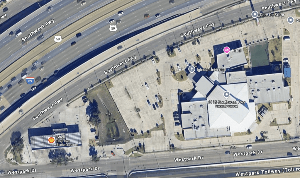 Aerial view of Southwest Freeway showing nearby businesses including a hotel and a Shell gas station.